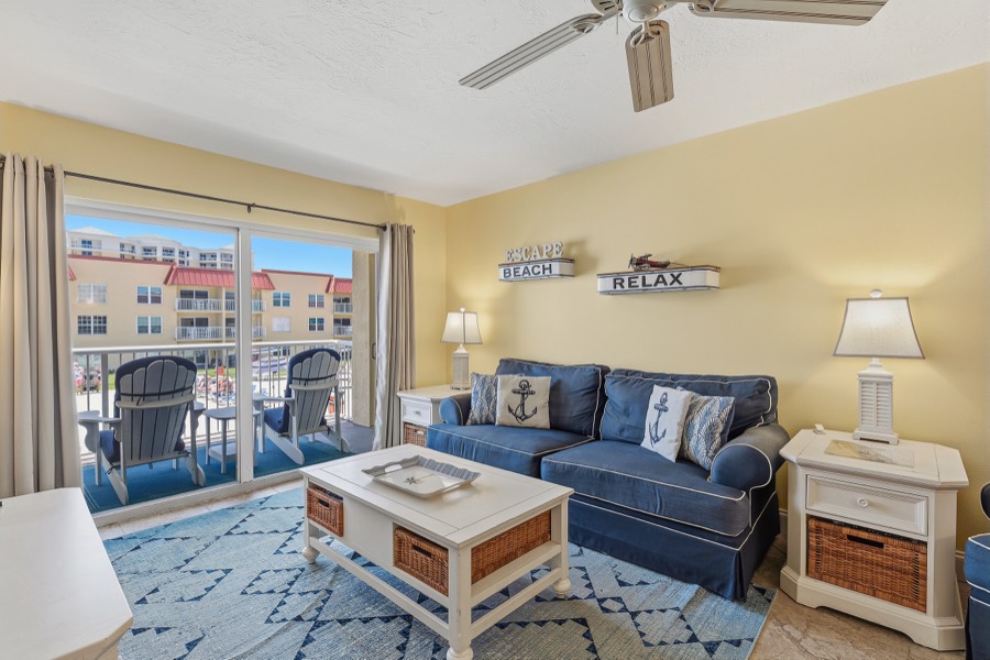 Yellow living room with navy slipcovered sofa and coastal decor
