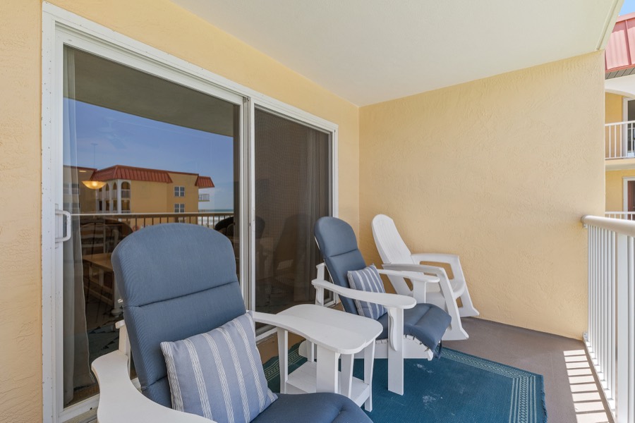 Balcony seating with striped pillows
