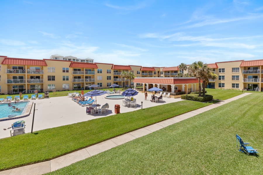 Elevated view of the Point East courtyard with pool, cabana pavilion, and lawns